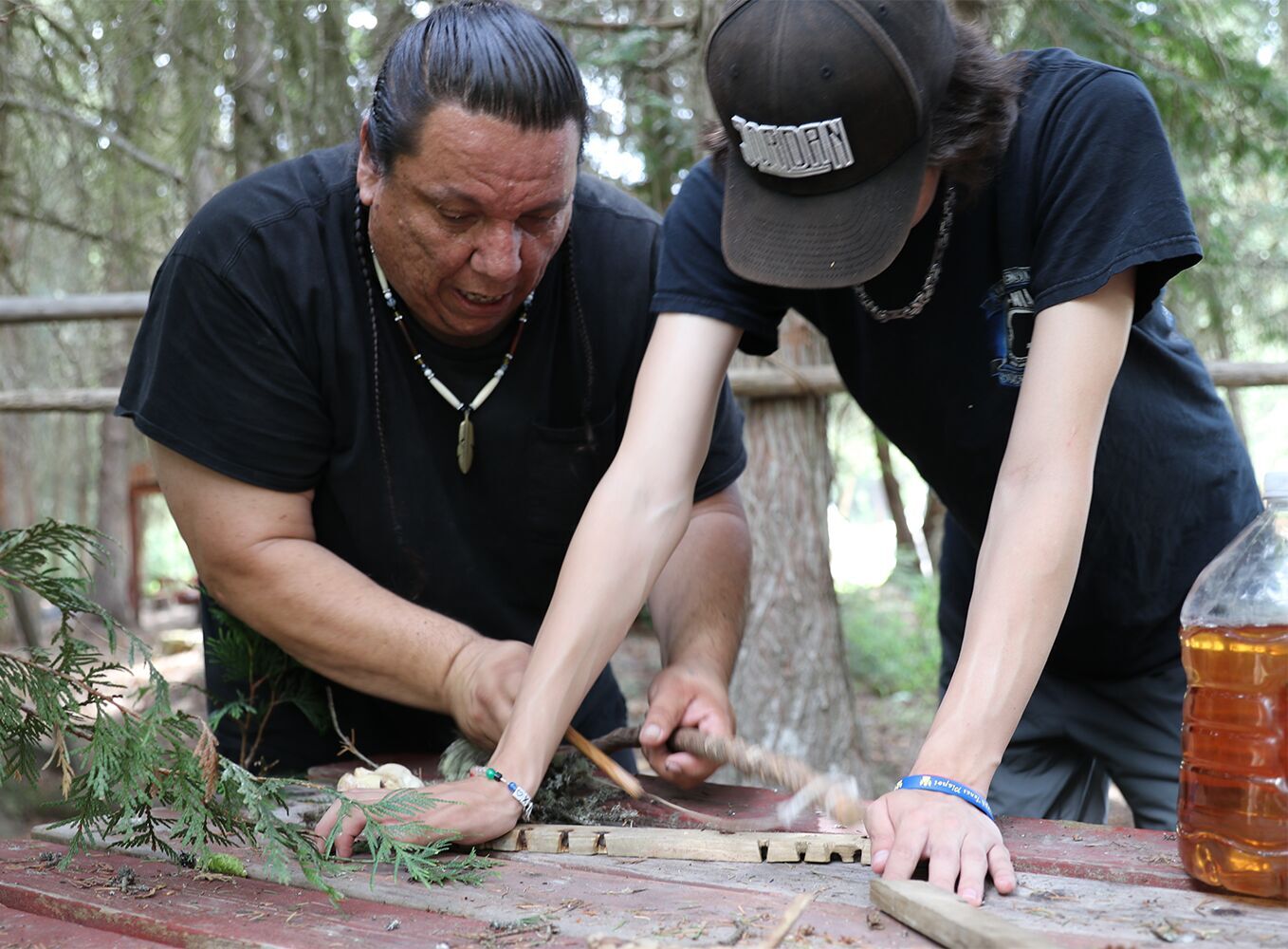 Making fire the old fashioned way.